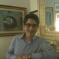 Law academic Daniele D'Alvia props his elbow on a mantlepiece